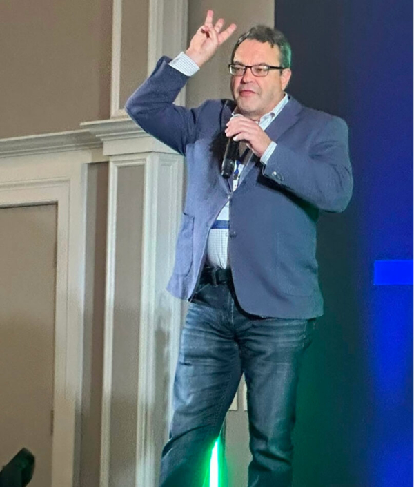 Jeff speaking at an event 2x